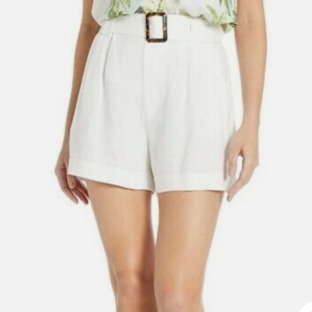 Show Me Your MuMu white linen belted shorts.
